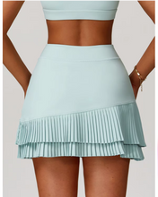 Falda de tenis con bajo festoneado, talle alto y corte en A.