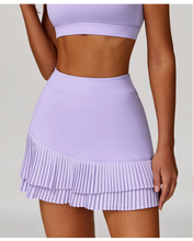 Falda de tenis con bajo festoneado, talle alto y corte en A.